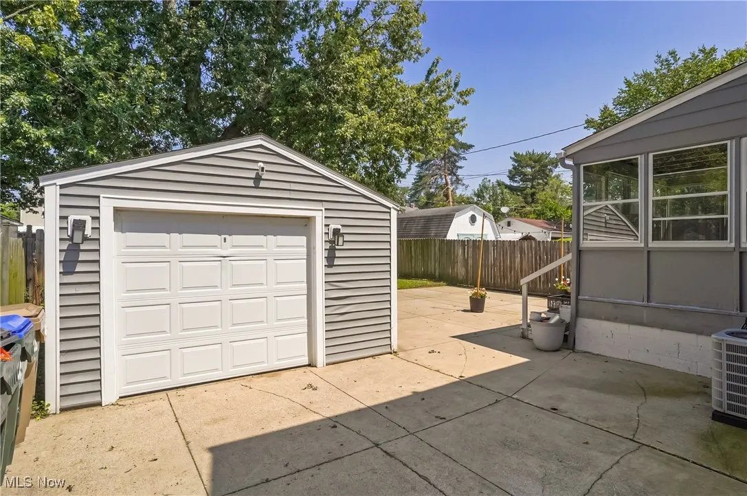 Detached garage featuring driveway
