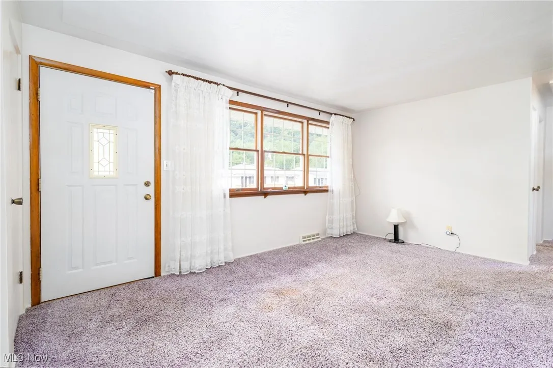 View of carpeted foyer entrance