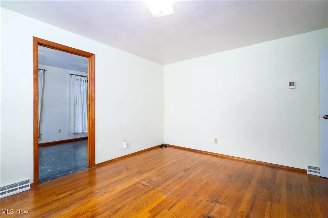 Unfurnished room with wood-type flooring