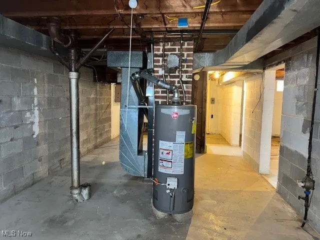 Utility room with gas water heater and heating unit