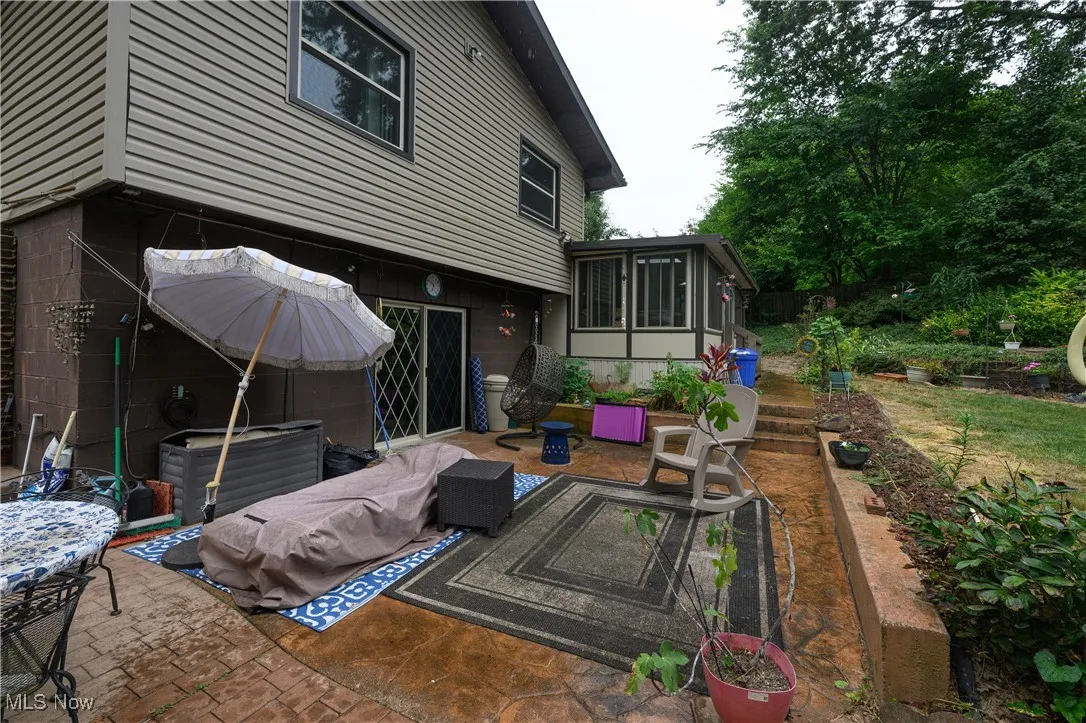 View of patio / terrace with a sunroom