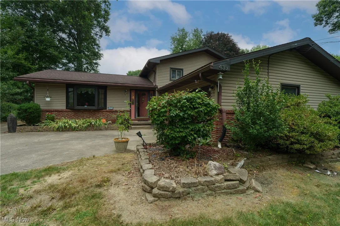 View of front of home featuring brick siding