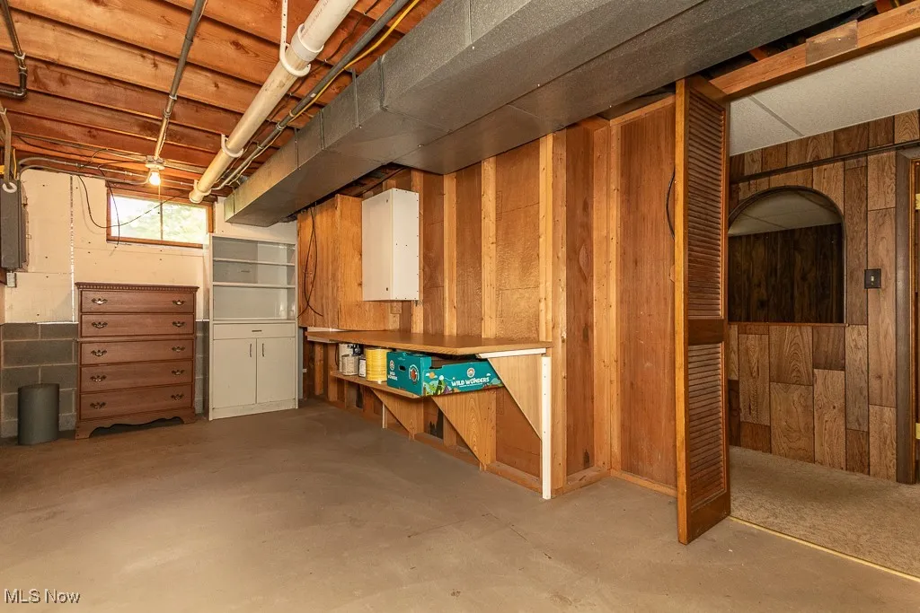 Below grade area with wood walls