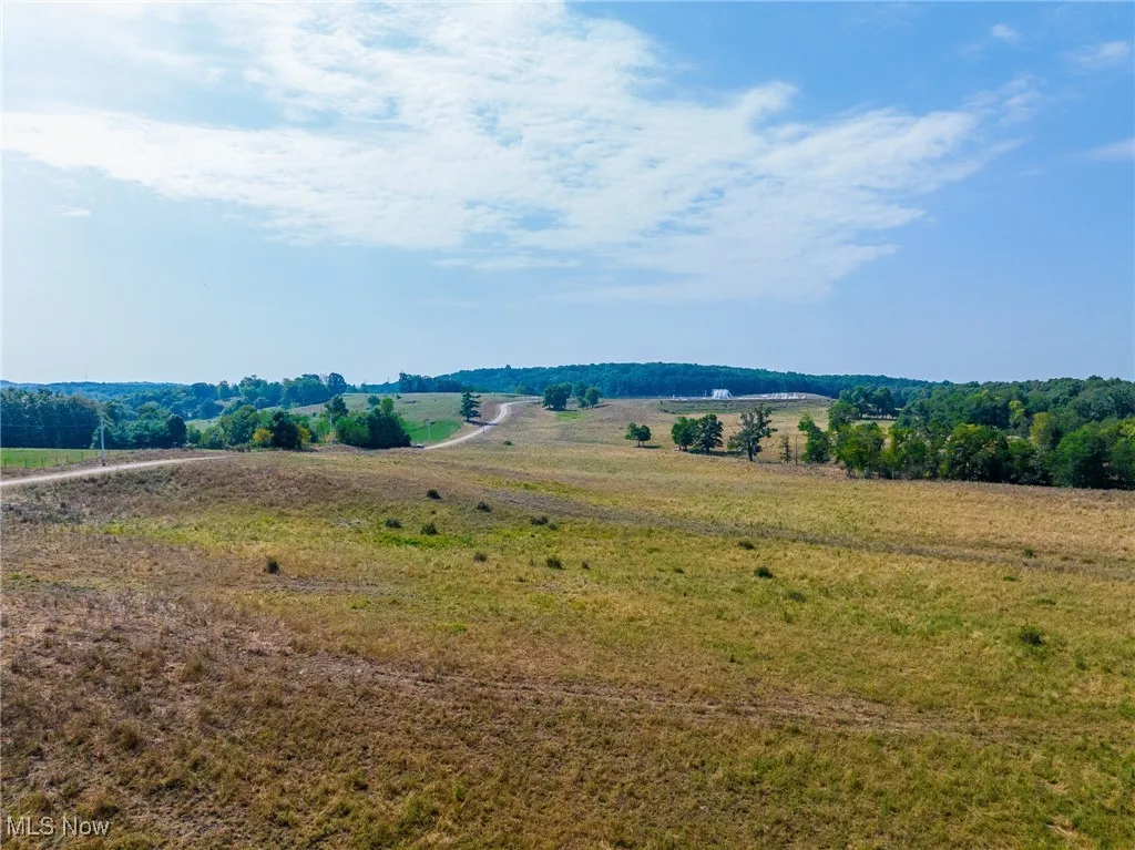 View of mountain backdrop featuring rural landscape