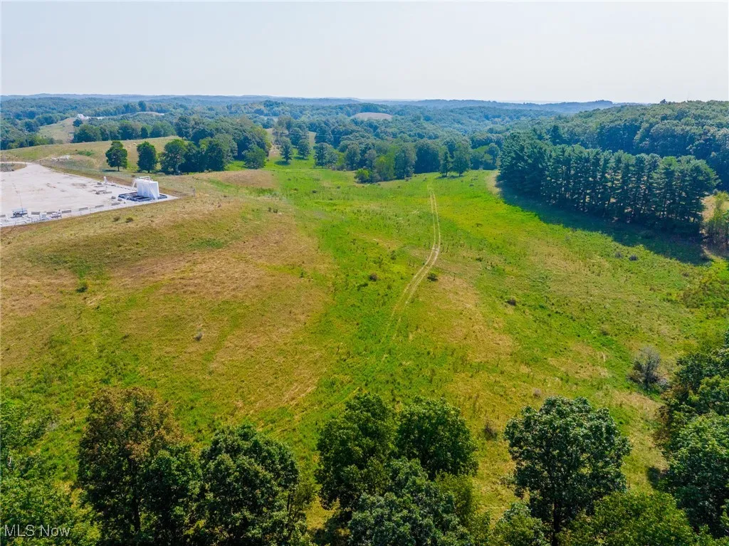View of rural area featuring a forest