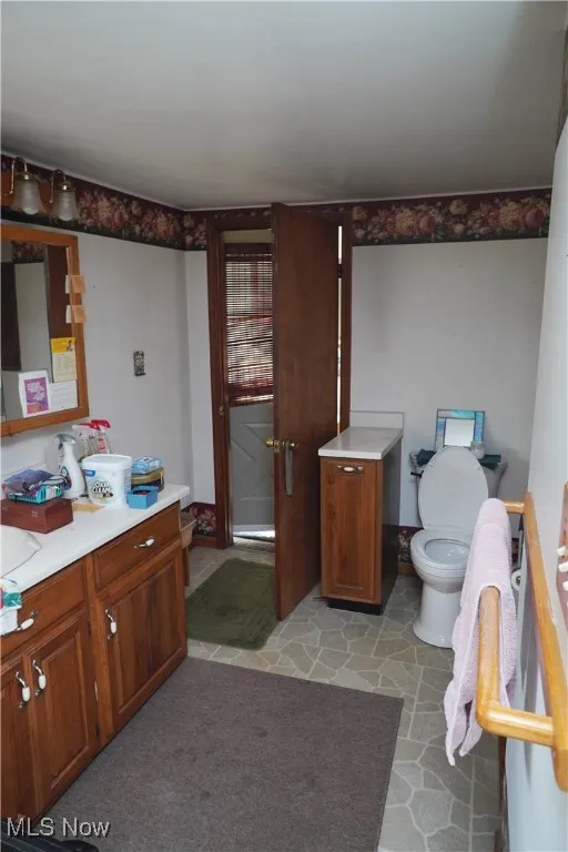 Bathroom with vanity and light tile patterned floors