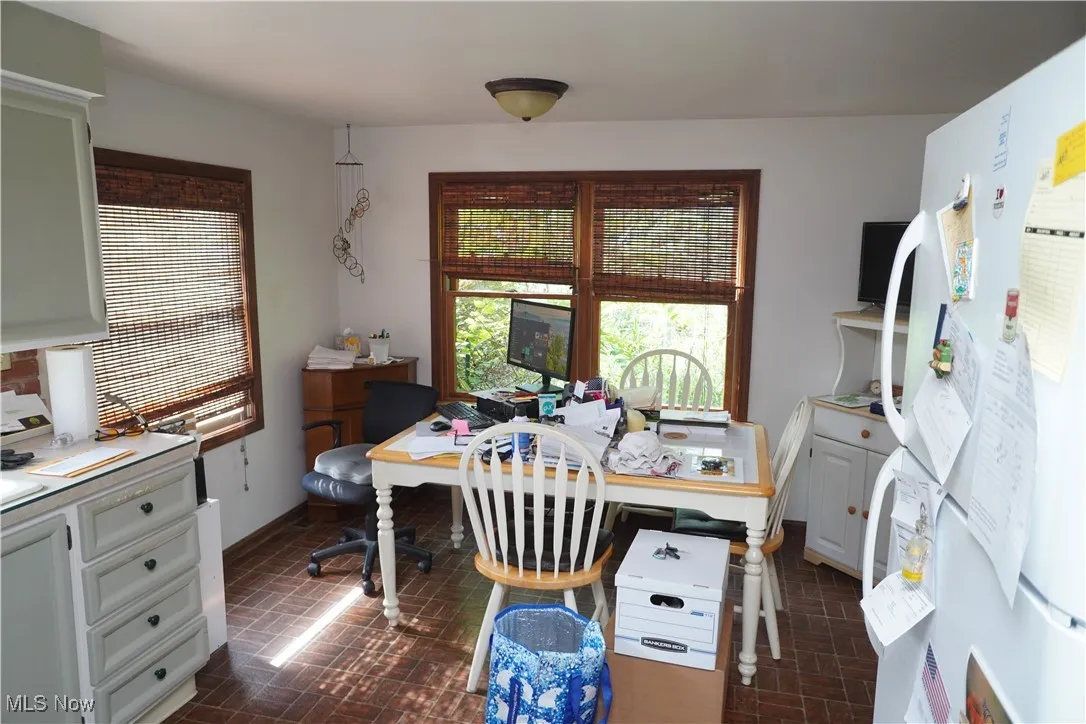 Office space featuring brick patterned flooring
