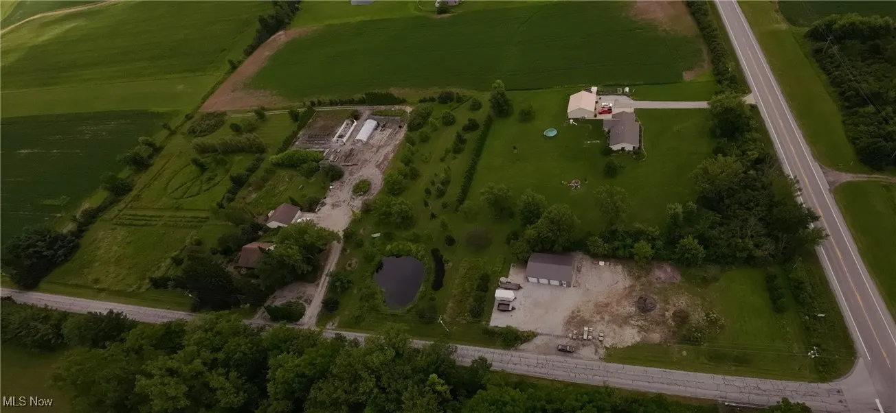 Aerial view of property and surrounding area with rural landscape and farmland