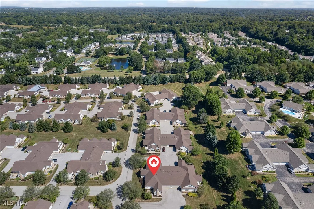 View of property location with nearby suburban area and a nearby body of water