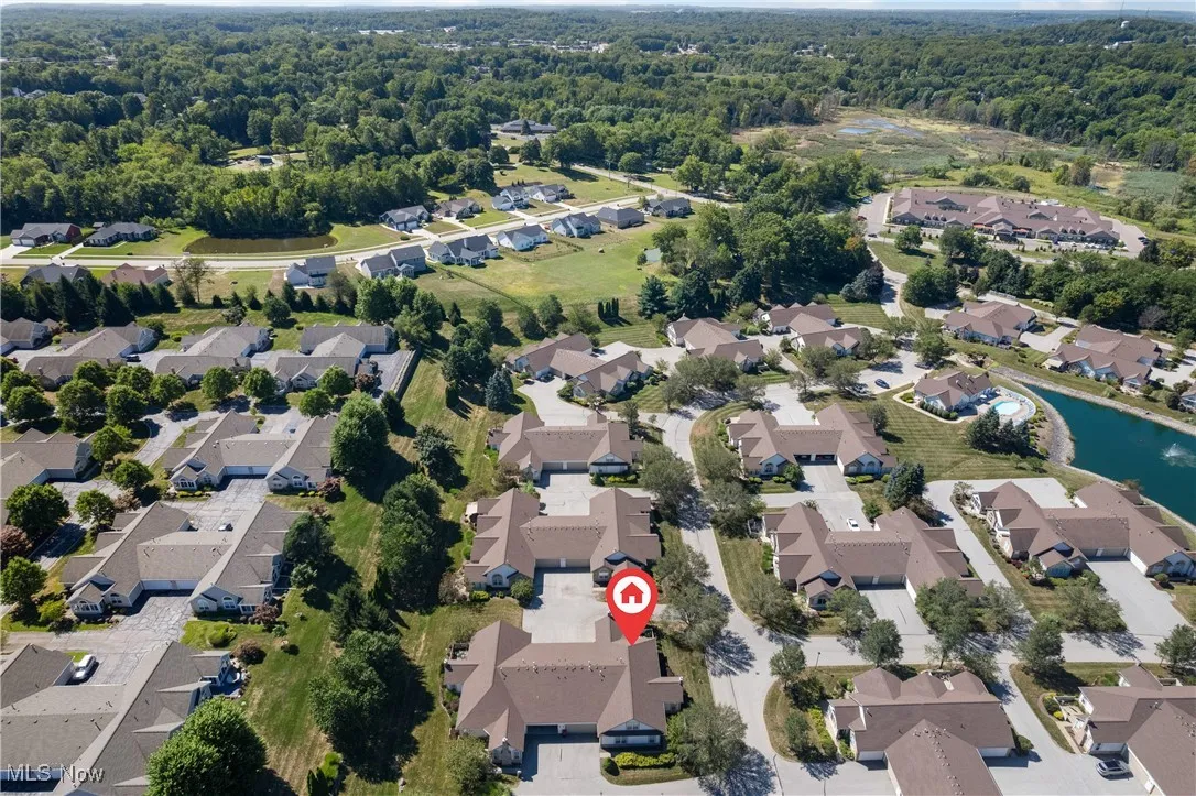 Aerial view of property's location featuring nearby suburban area
