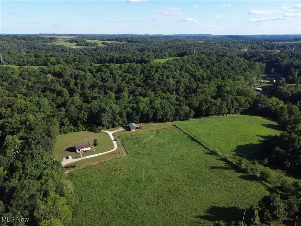 View of property location featuring a heavily wooded area