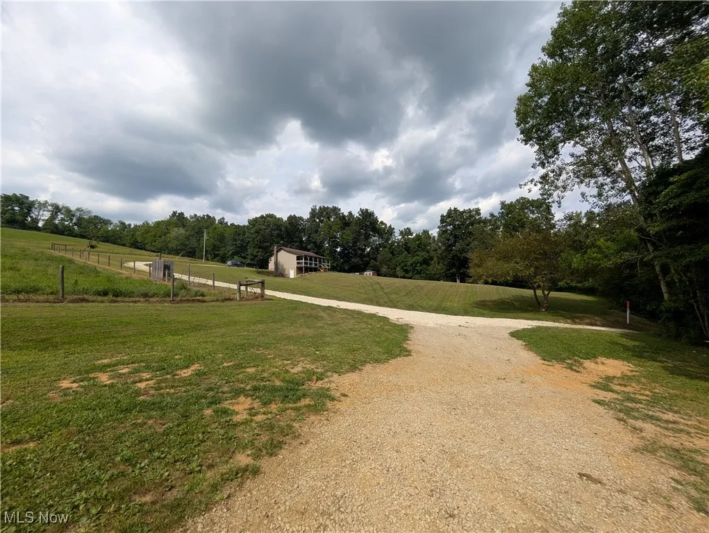 View of property's community with a view of rural / pastoral area and dirt driveway