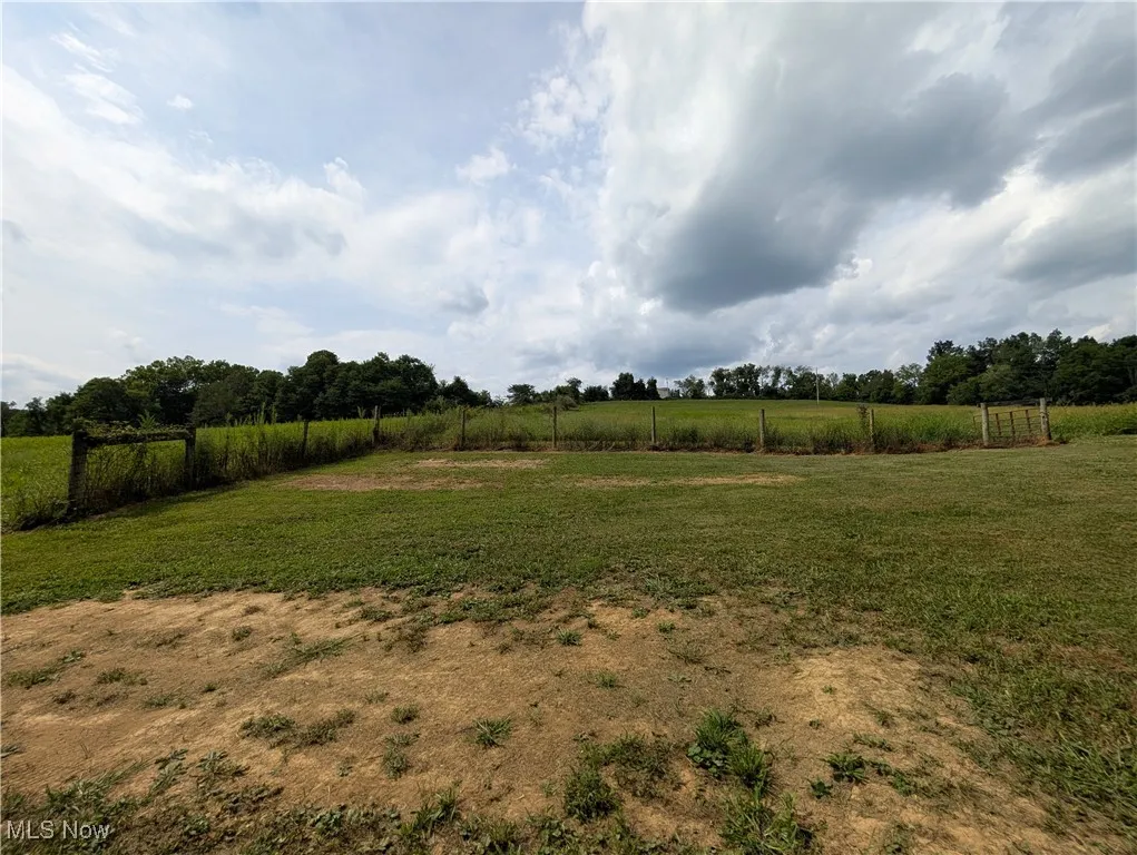 View of green lawn featuring a view of countryside