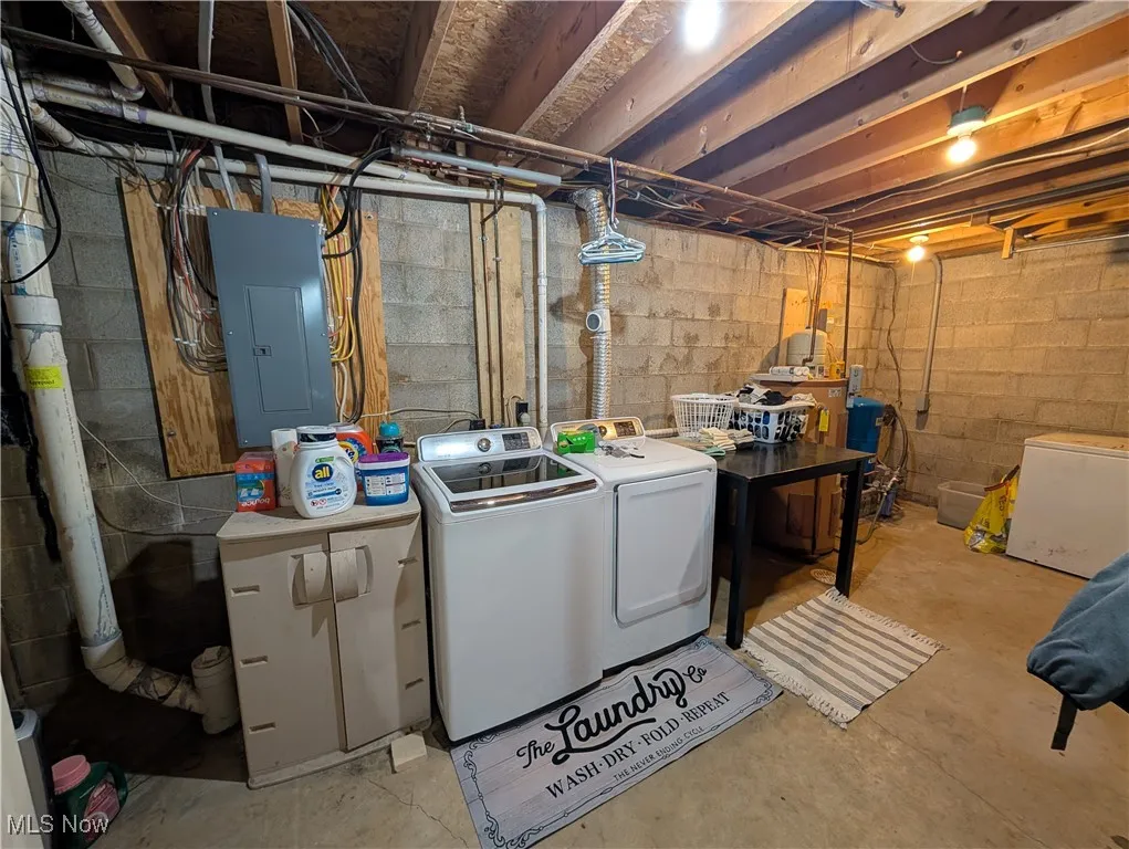 Washroom with electric panel and washer and dryer