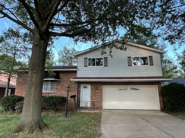 Welcome to 6565 Arbordale Ave! 2 car garage, brick siding, and driveway