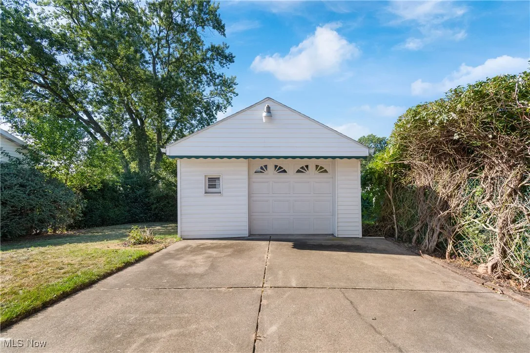 Detached garage featuring driveway