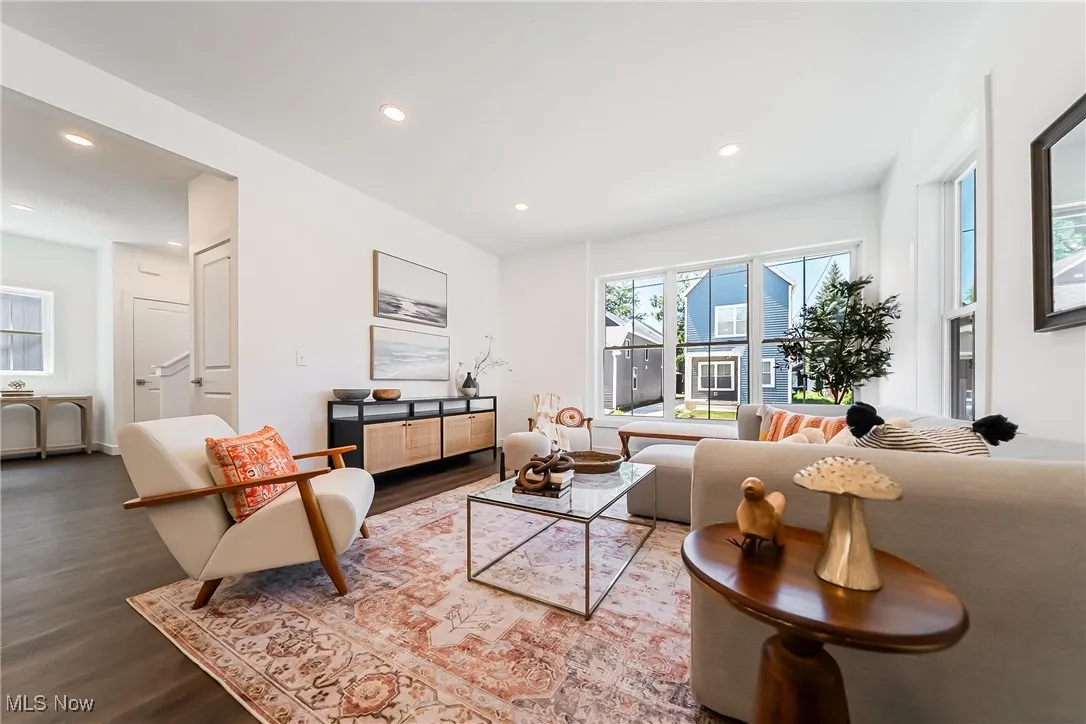 Living room with recessed lighting and wood-style floors