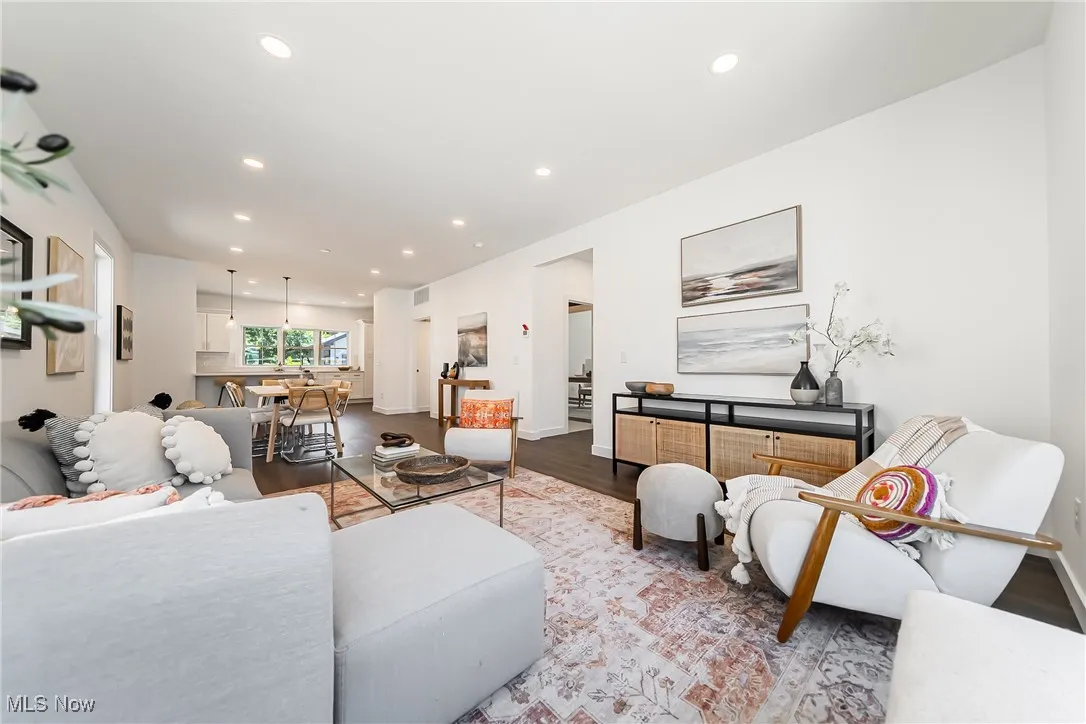Living room with recessed lighting and wood-style floors