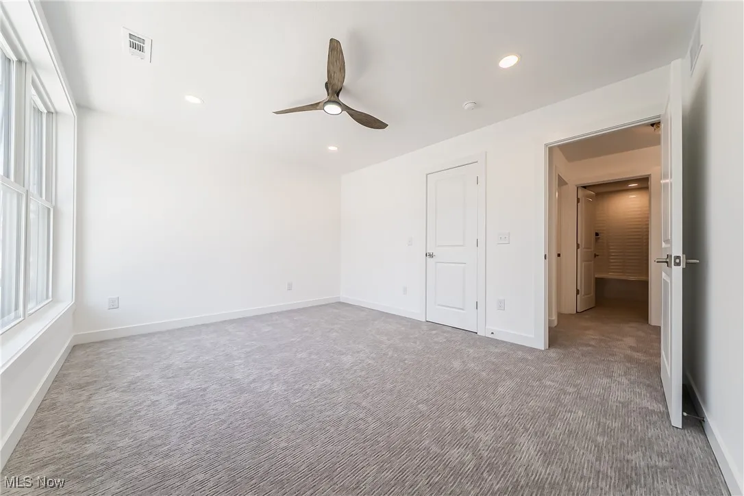 Bedroom featuring carpet floors, recessed lighting, and a ceiling fan