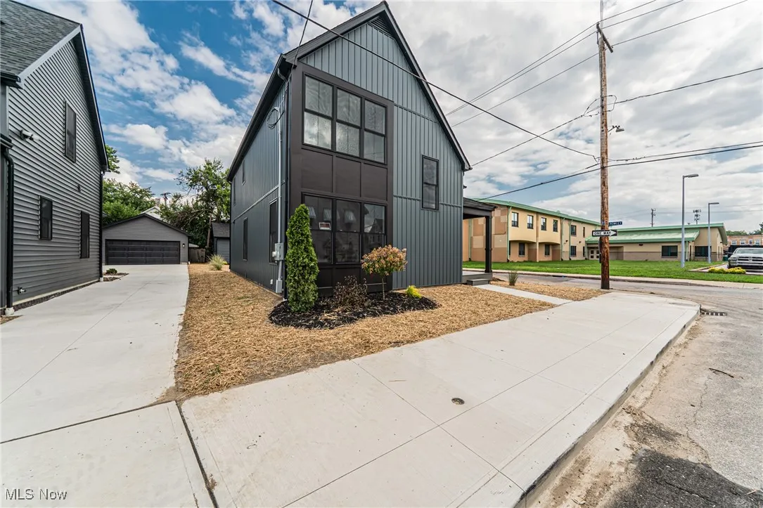 View of front of house with board and batten siding
