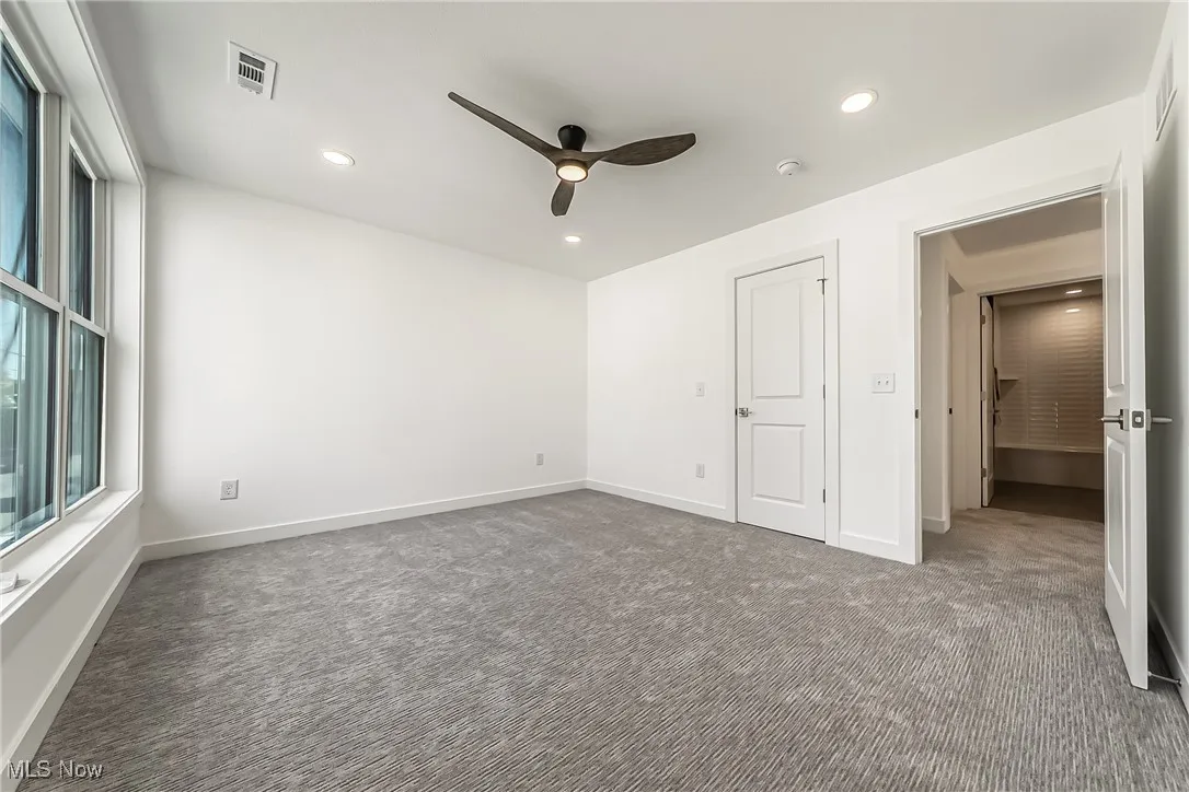 Bedroom featuring carpet flooring, recessed lighting, and a ceiling fan