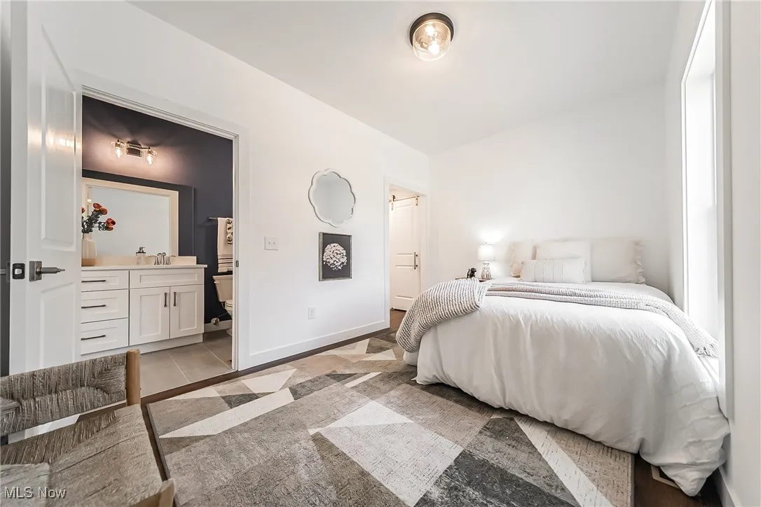 First floor bedroom or office featuring an attached bathroom