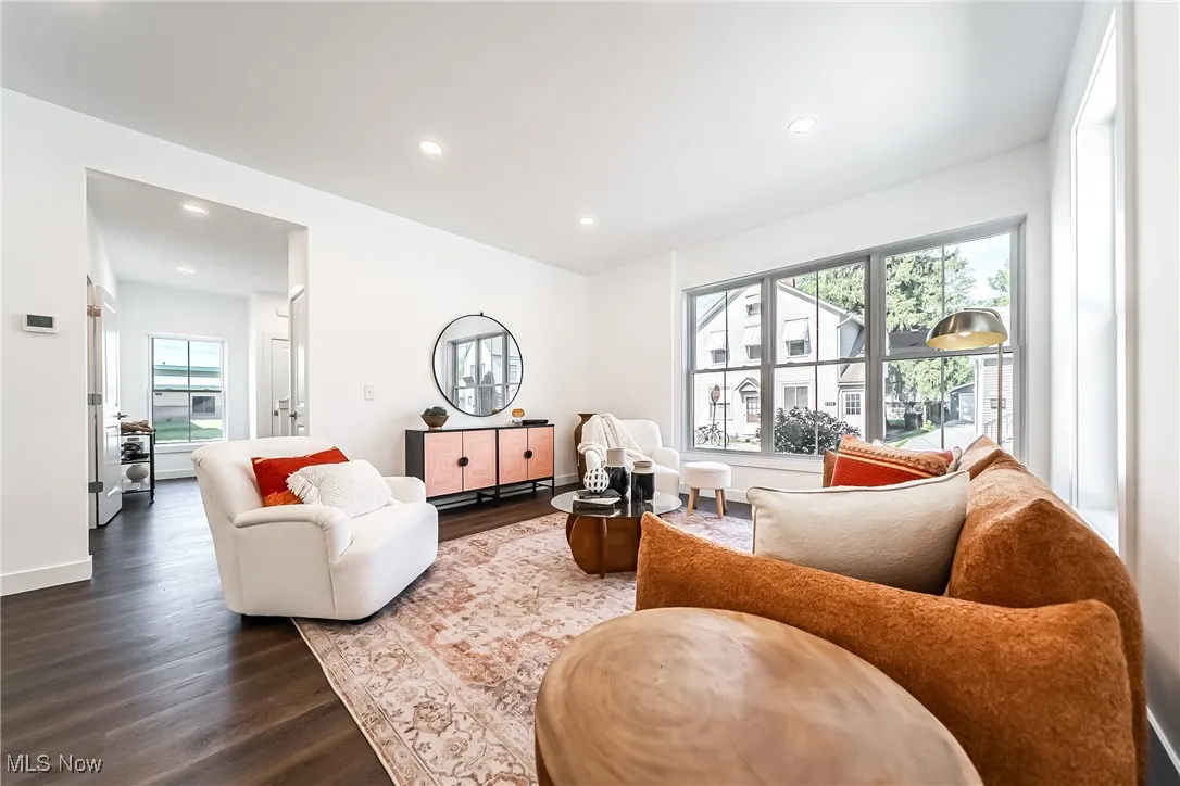 Living area featuring wood-style floors and recessed lighting