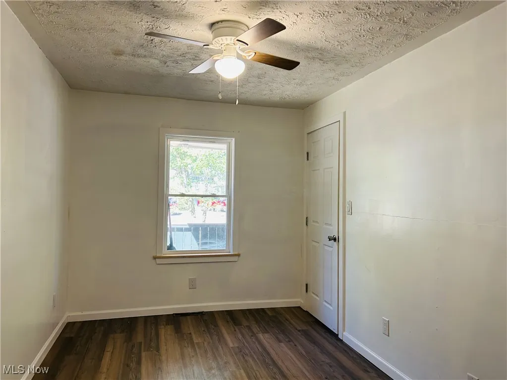 Bedroom featuring a ceiling fan and wood-style floors