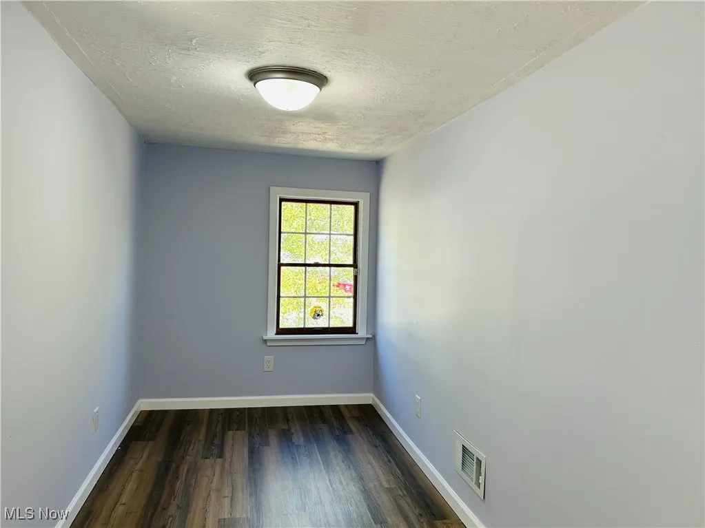 Bedroom with wood finished floors