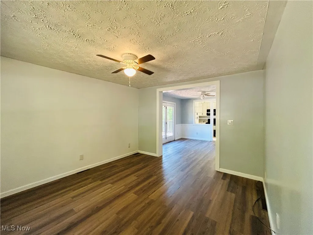 Living room featuring a ceiling fan