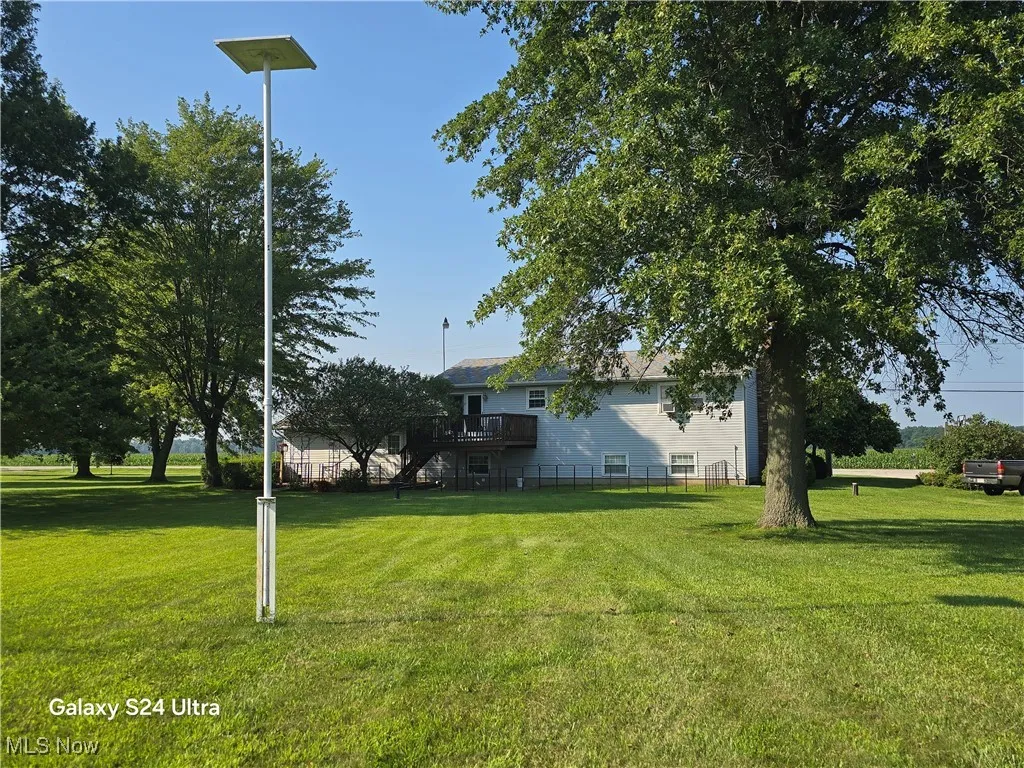 View of yard featuring a deck