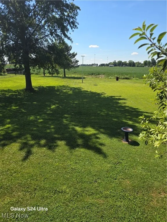 View of green lawn featuring a view of countryside