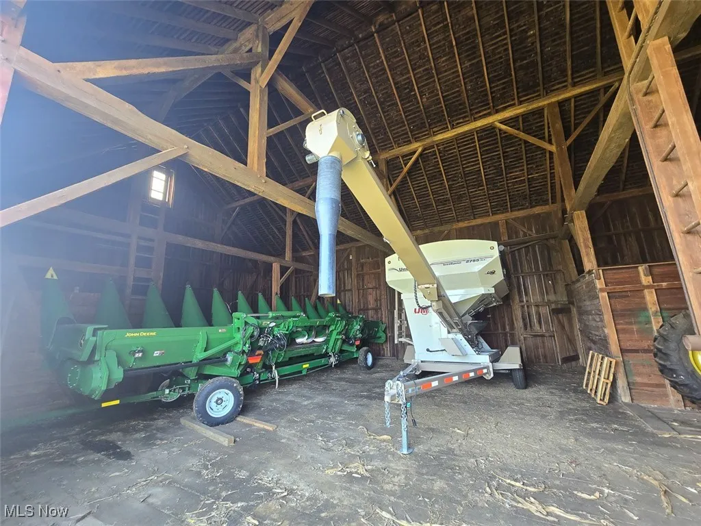 Misc room featuring lofted ceiling and a garage