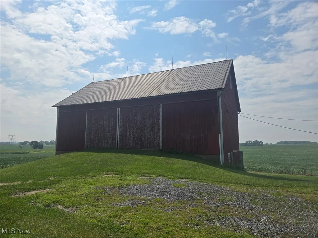 View of outdoor structure with a rural view