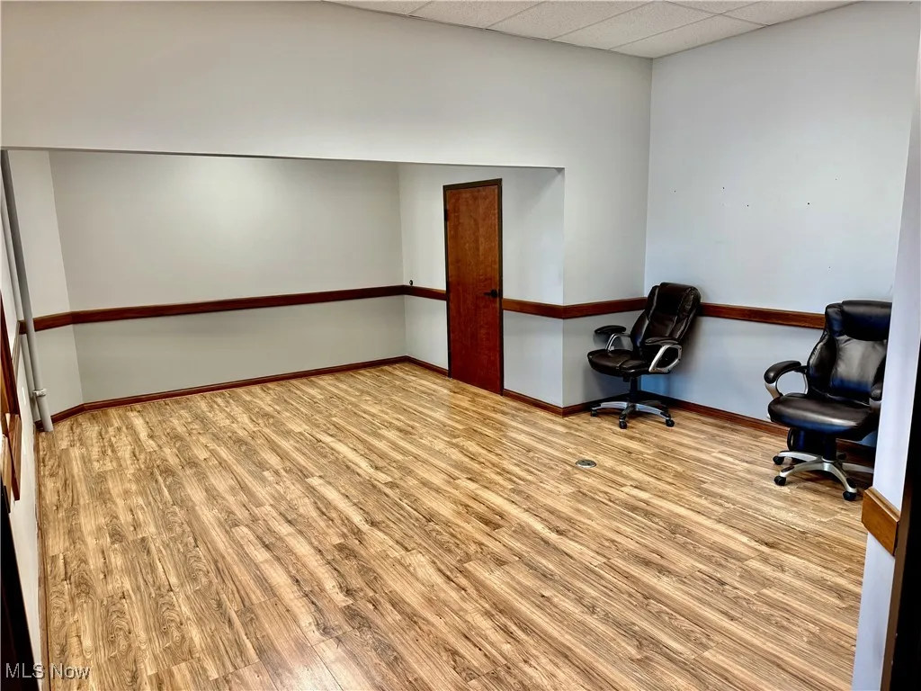 Here you go! Office #A measures 23'x14', and runs into the larger office space (or conference room) and the private office that faces west, looking out towards the parking area. Bathroom is the door straight ahead.