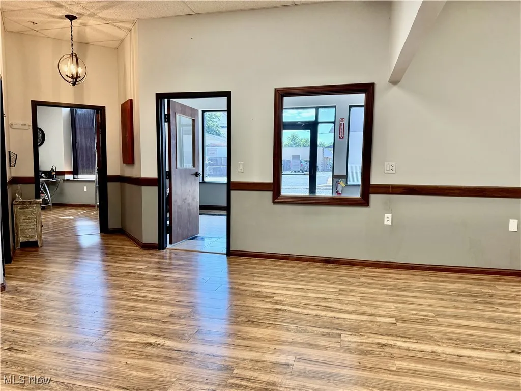 Here you go! Office #A measures 23'x14', and runs into the larger office space (or conference room) and the private office that faces west, looking out towards the parking area. Bathroom is to the right, Suite #B and Suite #C are to the left.
