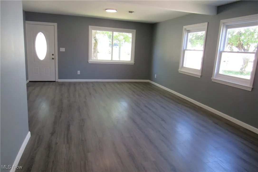 featuring vinyl-style floors and healthy amount of natural light