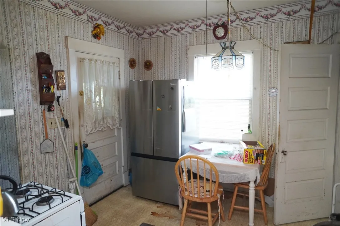 Dining room with wallpapered walls