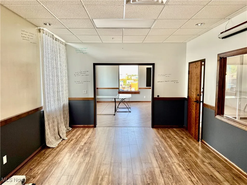 Executive Conference Room! Measuring 20'x12', and there's a view looking into the office area.