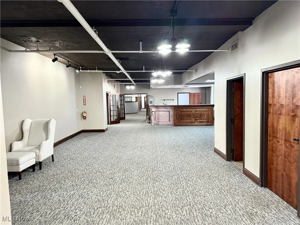 Welcome to the Second Floor Lobby! New carpet installed in 2022. Reception at the main entrance, private offices to the left. Main office area straight ahead.