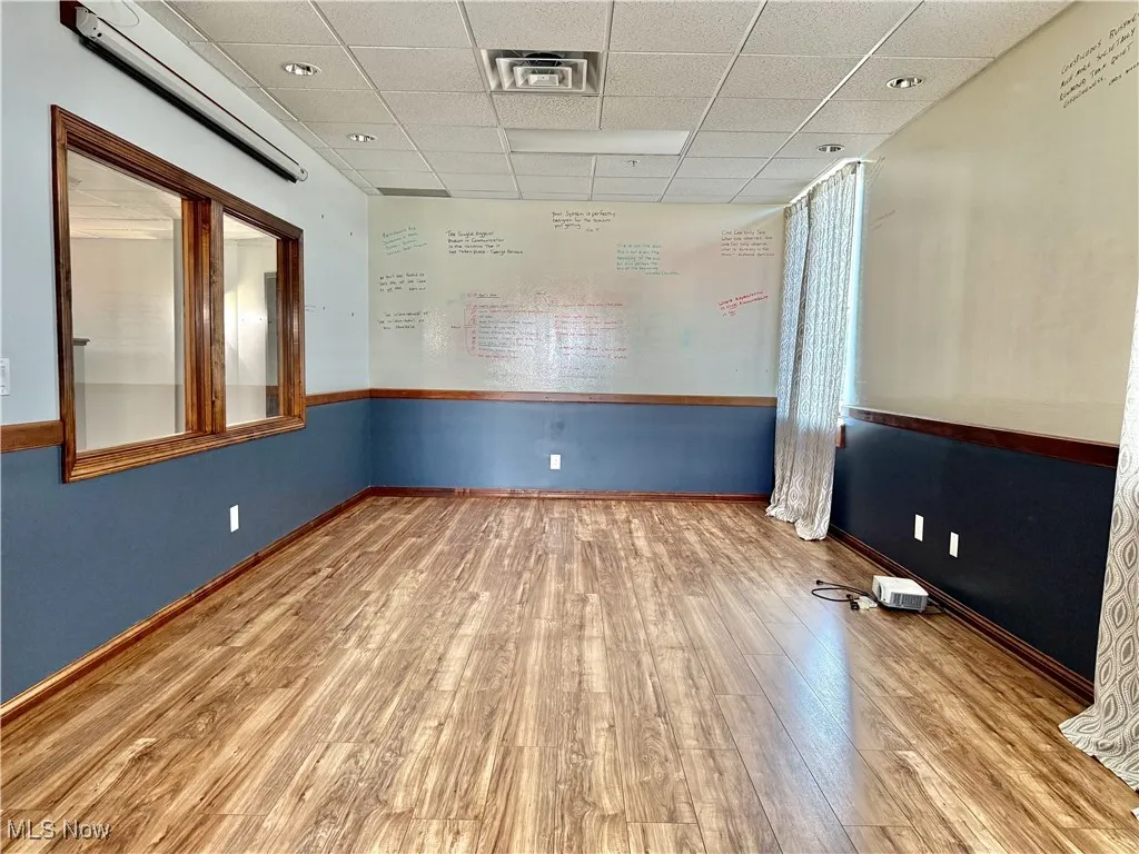 Executive Conference Room! Measuring 20'x12', and there's a view looking into the office area.
