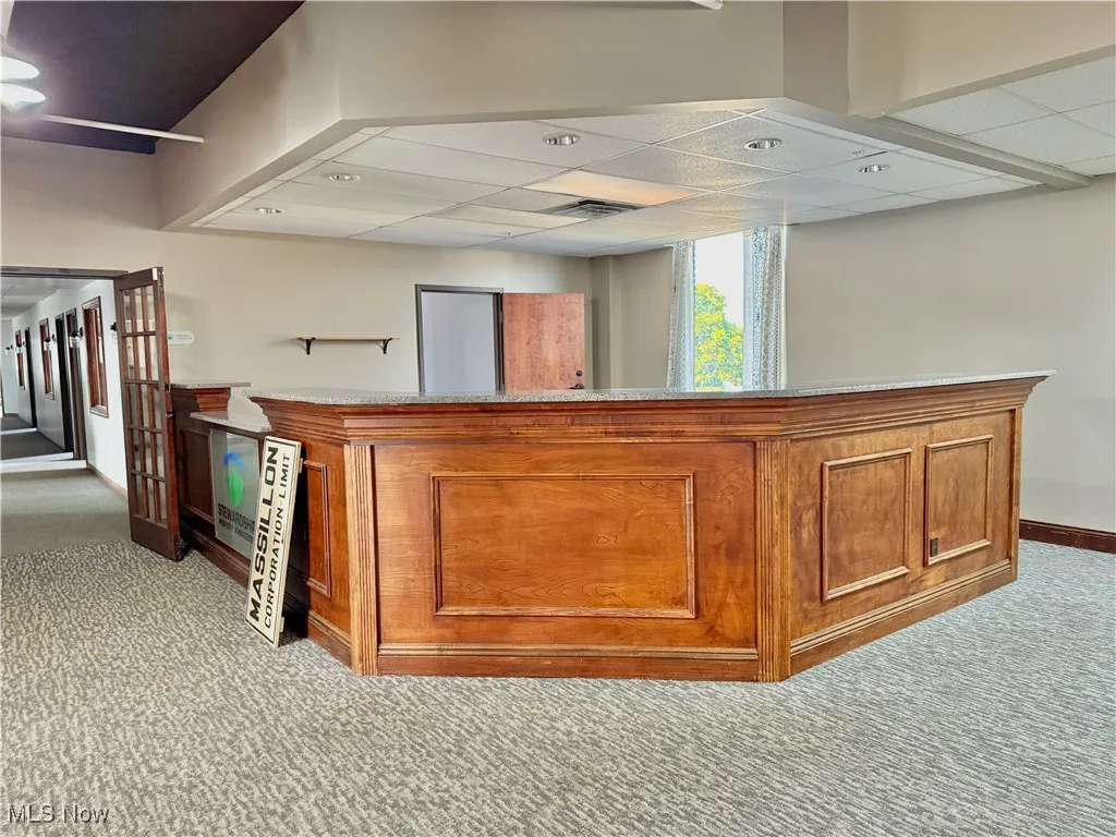 Welcome! This updated reception area (granite counter) is spacious at roughly 15'x14'.