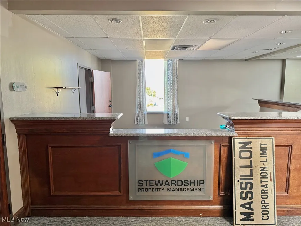Welcome! This updated reception area (granite counter) is spacious at roughly 15'x14'.