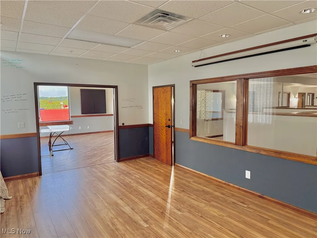 Executive Conference Room! Measuring 20'x12', and there's a view looking into the office area.