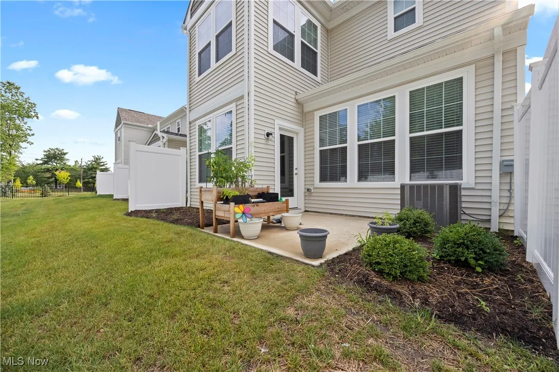 Rear view of property featuring a patio