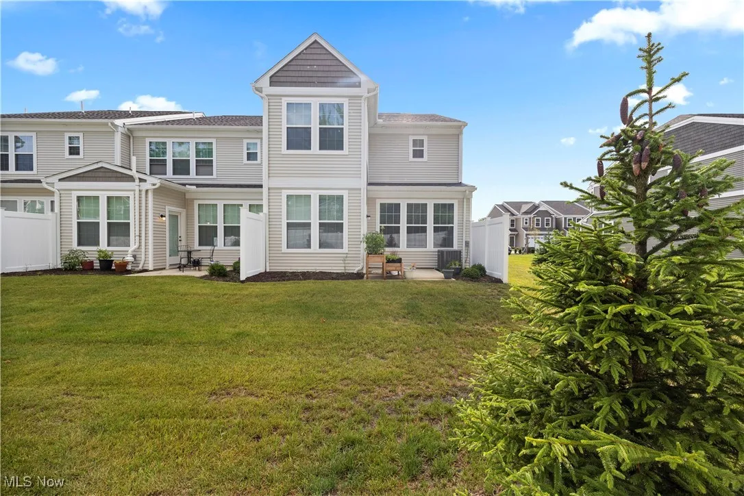 Rear view of house featuring a patio area