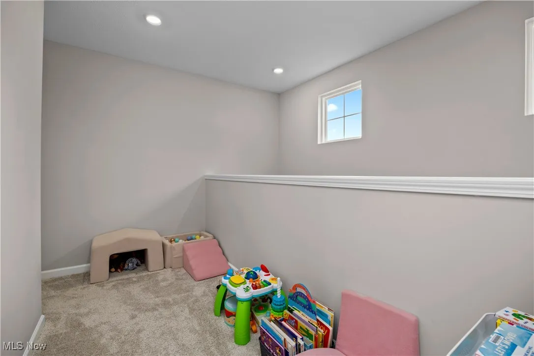 Playroom with carpet floors and recessed lighting