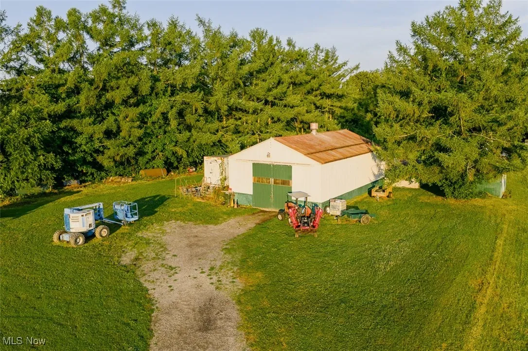 View of subject property with a forest