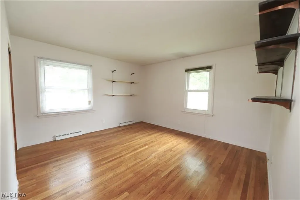 Empty room featuring light wood finished floors