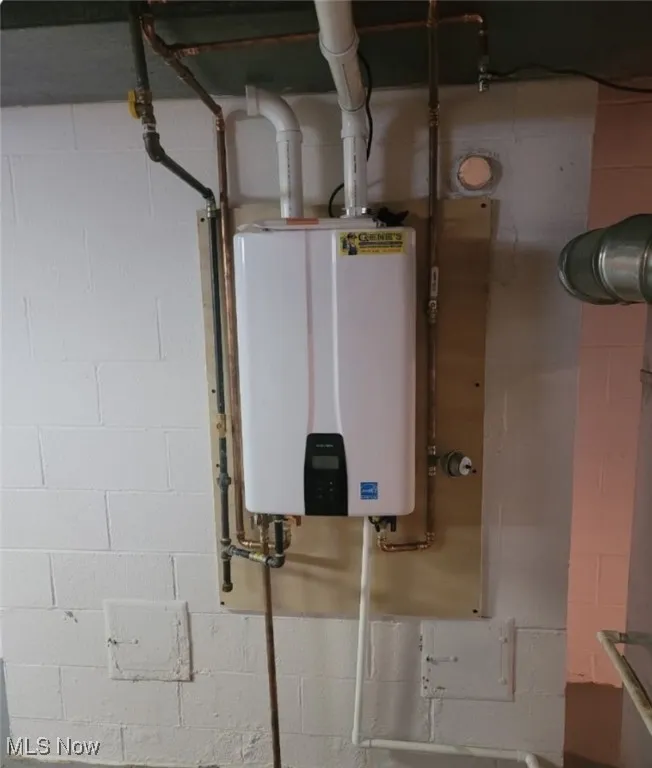 Utility room with tankless water heater